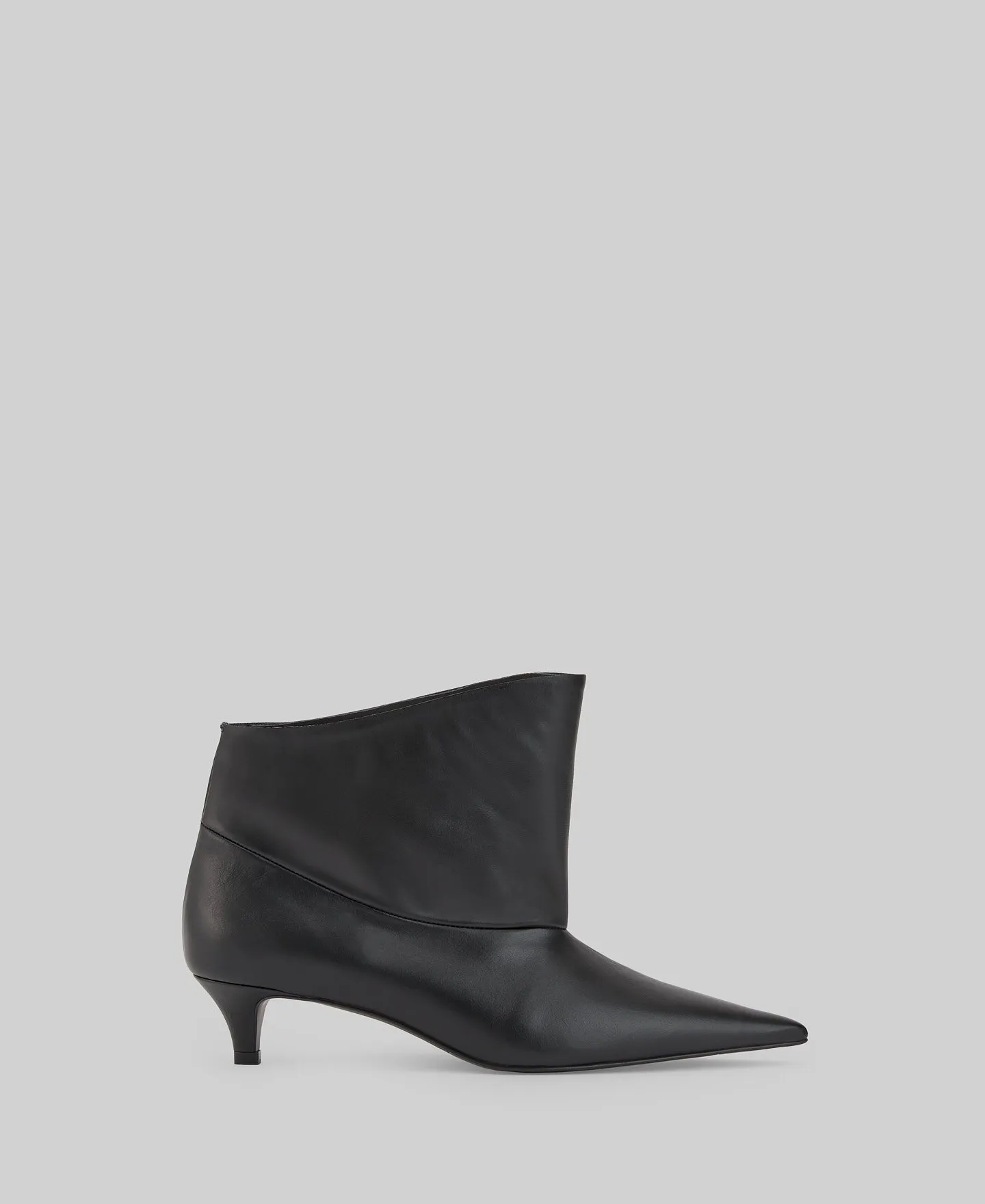 Asymmetric leather ankle boots woman