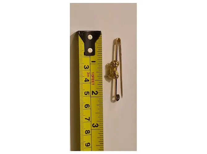 Autre Marque Broche barra perro pequinés dorado Gold hardware 