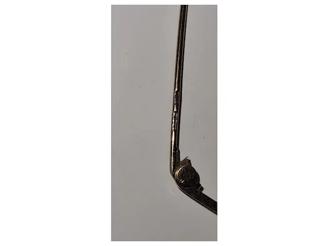 Autre Marque Broche barra perro pequinés dorado Gold hardware 